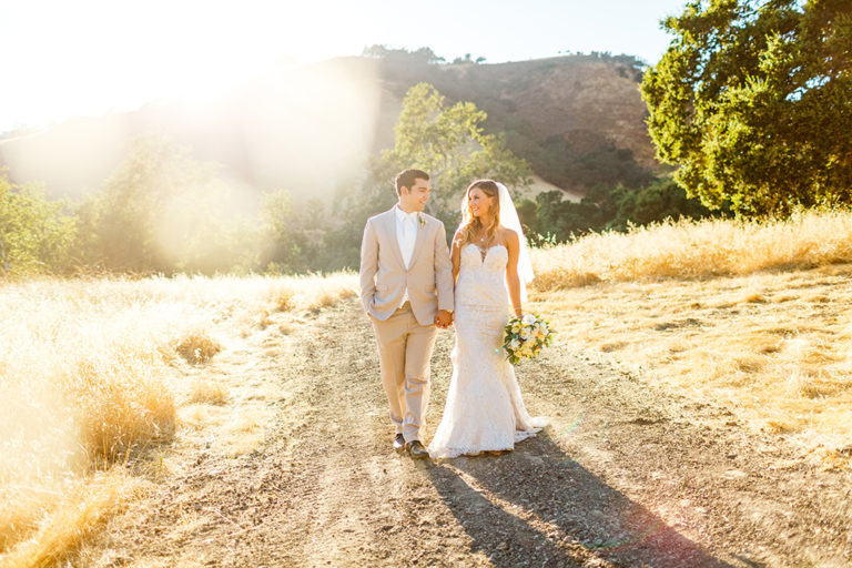 Bride and groom during sunset at Higuera Ranch wedding in San Luis Obispo