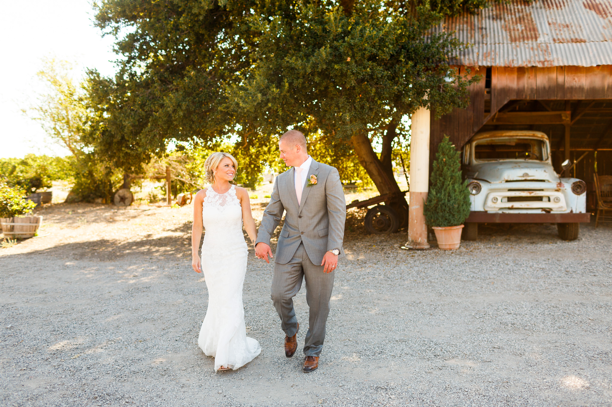 Bride and groom walking together at Dana Powers Barn