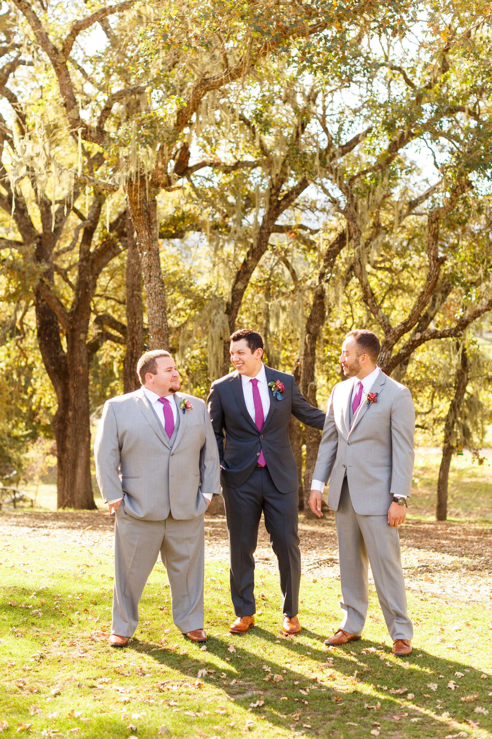 Groom and his groomsmen hanging out before the Spanish Oaks Ranch wedding