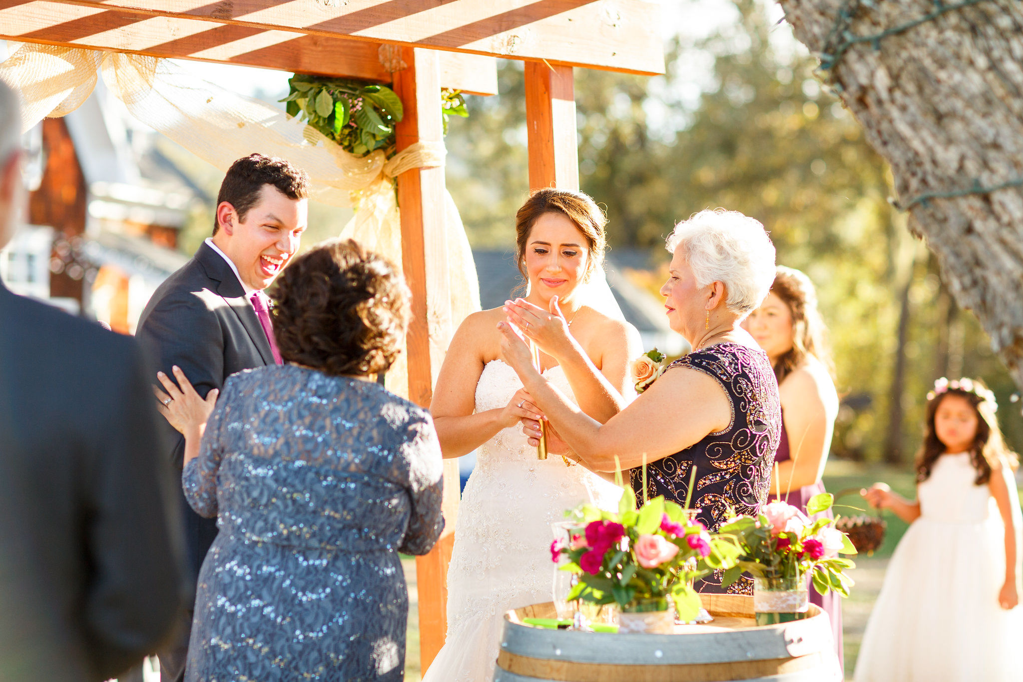 Mothers lighting candles during ceremony at Spanish Oaks Ranch wedding