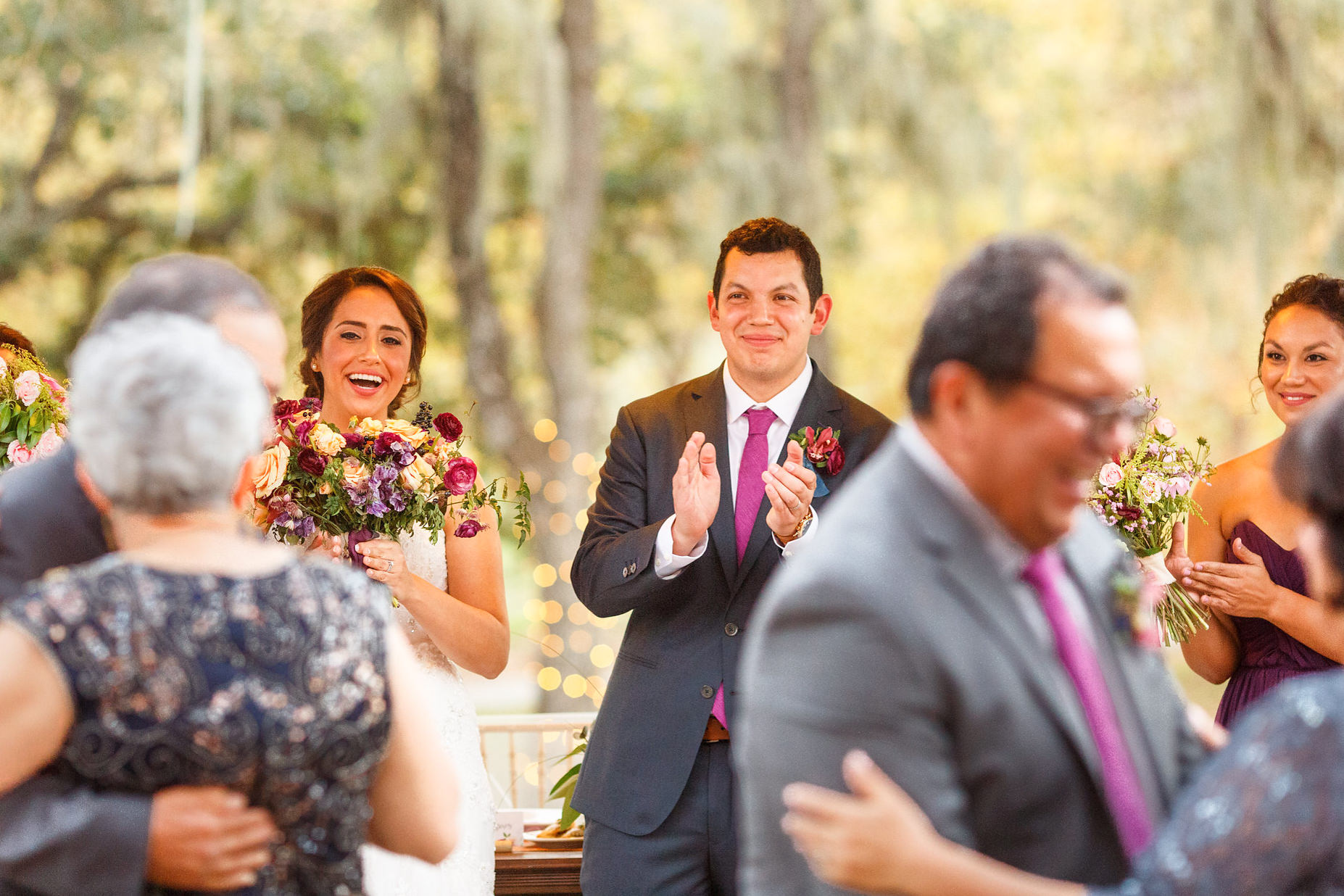Bride and groom watching parents dancing at Spanish Oaks Ranch wedding
